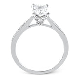 The delicate, understated design of this lovely white gold ring is elevated by .27 ctw of round white diamond accents.
