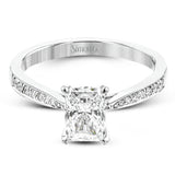 The delicate, understated design of this lovely white gold ring is elevated by .27 ctw of round white diamond accents.