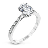 The delicate, understated design of this lovely white gold ring is elevated by .27 ctw of round white diamond accents.
