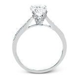The delicate, understated design of this lovely white gold ring is elevated by .27 ctw of round white diamond accents.