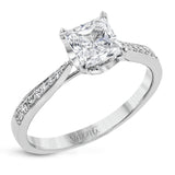 The delicate, understated design of this lovely white gold ring is elevated by .27 ctw of round white diamond accents.