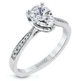The delicate, understated design of this lovely white gold ring is elevated by .27 ctw of round white diamond accents.