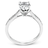 The delicate, understated design of this lovely white gold ring is elevated by .27 ctw of round white diamond accents.