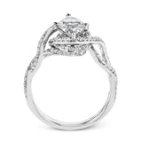 Classic with a modern twist, this white gold engagement ring features .50 ctw of sparkling white diamonds in a dramatic openwork design.