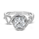 Classic with a modern twist, this white gold engagement ring features .50 ctw of sparkling white diamonds in a dramatic openwork design.