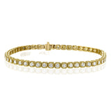 A modern take on a stackable diamond tennis bracelet, this timeless yellow gold design is setting with a total of 2.00 ct of white diamonds.