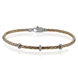 This easy-to-wear bracelet features three white gold stations set with .10ctw of diamonds set in a woven braid of 18k rose gold.