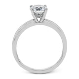 This singular engagement accents the center stone with a touch of .03 ctw of diamonds around the secure basket setting, while the band shines in high polish metal.