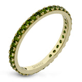 This simple 18k band adds a perfect touch of color with .38 ctw of emeralds.