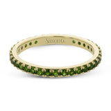 This simple 18k band adds a perfect touch of color with .38 ctw of emeralds.