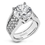 This engagement ring sure is a stunner with a wide band set with a full 1.20 ctw of white diamonds.