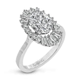 This stunning 18K WG engagement ring is inspired by a ballerinas skirt and features 0.21 ctw RD diam and 0.62 ctw of baguettes, surrounding the center