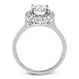 This stunning 18K WG engagement ring is inspired by a ballerinas skirt and features 0.21 ctw RD diam and 0.62 ctw of baguettes, surrounding the center