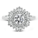 Crafted from 18k gold, this halo ring features a stunning .36 ctw of round diamonds and .49 ctw of baguette shaped diamonds.