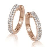 A full 1.00 ctw of round white diamonds form two rows of sparkle in these lovely 18k rose gold hoop earrings.