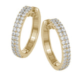 A full 1.00 ctw of round white diamonds form two rows of sparkle in these lovely 18k yellow gold hoop earrings.
