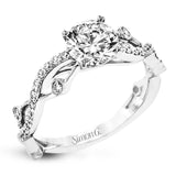 A modern, unique design, this 18k gold engagement ring featuring an intertwined design set with .22 ctw of white diamonds.