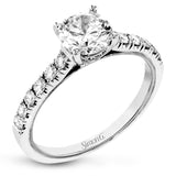 This classic 18k gold engagement ring setting contains .37 ctw of sparkling white diamonds.