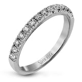 This classic 18k gold engagement ring setting contains .37 ctw of sparkling white diamonds.