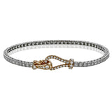 This 18k white and rose gold bracelet makes quite a statement with a buckle clasp and a full 1.00 ctw of white diamonds.
