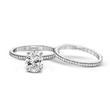 The classic, streamlined design of this 18k rose gold wedding set is accented by .30 ctw of sparkling white round brilliant diamonds.