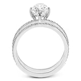 The classic, streamlined design of this 18k rose gold wedding set is accented by .30 ctw of sparkling white round brilliant diamonds.
