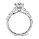 A beautiful row of .86 ctw of significant diamonds leads up to the center stone in this timeless engagement ring design.