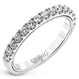 A beautiful row of .86 ctw of significant diamonds leads up to the center stone in this timeless engagement ring design.