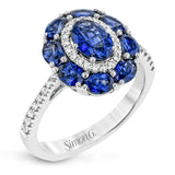 This gemstone ring is the perfect addition to any look, with a 1.52 ct sapphire center stone surrounded my .77 ctw oval sapphires and .21 ctw of white diamonds.
