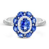 This gemstone ring is the perfect addition to any look, with a 1.52 ct sapphire center stone surrounded my .77 ctw oval sapphires and .21 ctw of white diamonds.