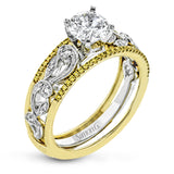 This remarkable set provides the looks of three rings, with a yellow gold ring guard set with yellow diamonds that encompasses the center white gold engagement ring.