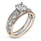 This remarkable set provides the looks of three rings, with a yellow gold ring guard set with yellow diamonds that encompasses the center white gold engagement ring.