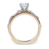 This remarkable set provides the looks of three rings, with a yellow gold ring guard set with yellow diamonds that encompasses the center white gold engagement ring.