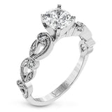 This remarkable set provides the looks of three rings, with a yellow gold ring guard set with yellow diamonds that encompasses the center white gold engagement ring.