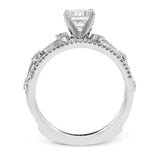This remarkable set provides the looks of three rings, with a yellow gold ring guard set with yellow diamonds that encompasses the center white gold engagement ring.