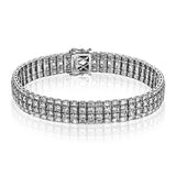 Crafted in 18k white gold, this bracelet makes a bold, modern statement with 4.74 ctw baguette shaped diamonds and 7.68 ctw classic round diamonds.