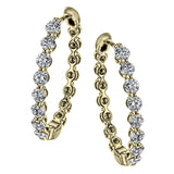 A modern take on a hoop earring, this lovely pair contain .99 ctw of sparkling white diamonds.