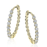 This pair of 18k yellow gold hoop earrings are the perfect size for everyday wear, and shine with .33 ctw of yellow diamonds.