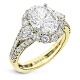 This glamorous white gold ring features 1.01 ctw of round white diamonds and .62 ctw of pear shaped white diamonds as a dazzling backdrop for the center stone