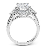 This glamorous white gold ring features 1.01 ctw of round white diamonds and .62 ctw of pear shaped white diamonds as a dazzling backdrop for the center stone