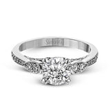 This absolutely charming white gold ring features a subtle, nature-inspired design as well as .32 ctw of round white diamonds.
