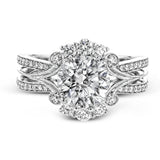 Turn heads with this stunning white gold ring that glitters with an impressive .58 ctw of round white diamond accents.