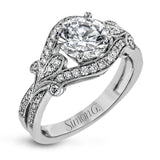 This absolutely exquisite white gold engagement ring dazzles the eye with .38 ctw of round white diamonds in a glamorous, vintage-inspired setting.