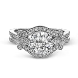 This absolutely exquisite white gold engagement ring dazzles the eye with .38 ctw of round white diamonds in a glamorous, vintage-inspired setting.