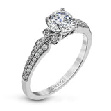 This remarkable white gold ring features .18 ctw of round white diamonds and delicate milgrain edging for a sleek, romantic look.