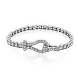 This 18k white gold bracelet makes quite a statement with a buckle clasp and a full 1.00 ctw of white diamonds.