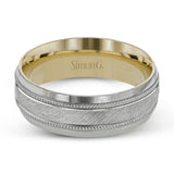A textured white gold exterior conceals a rose gold interior accent in this elegant, modern wedding band