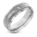 A textured white gold exterior conceals a rose gold interior accent in this elegant, modern wedding band