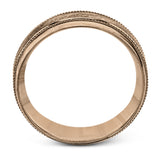 A textured white gold exterior conceals a rose gold interior accent in this elegant, modern wedding band