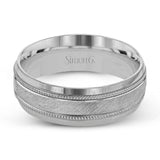 A textured white gold exterior conceals a rose gold interior accent in this elegant, modern wedding band